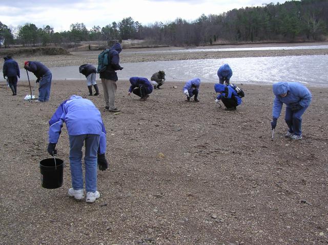 collecting fossils in gravel by lake